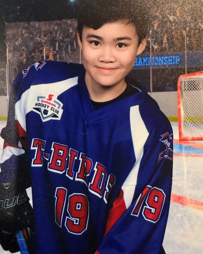 Matthew Shen in his T-Birds hockey jersey, number 19